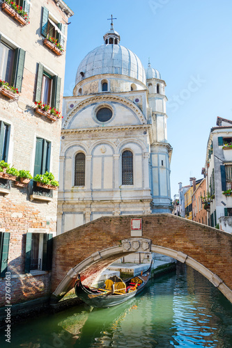 View of the canal, bridge and church of Santa Maria dei Miracoli, Venice, Italy