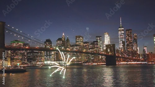 Fireworks over downtown manhattan Brooklyn Bridge at dusk of fireworks and starry sky New York City city blurred lights