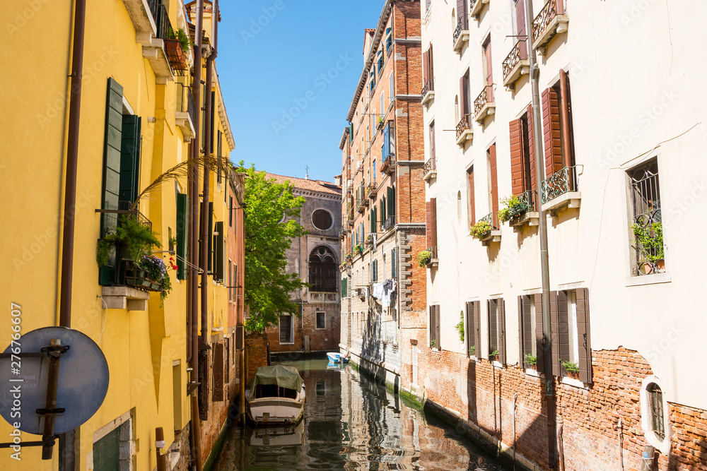 View of the canal, old houses and bridge in Venice, Italy