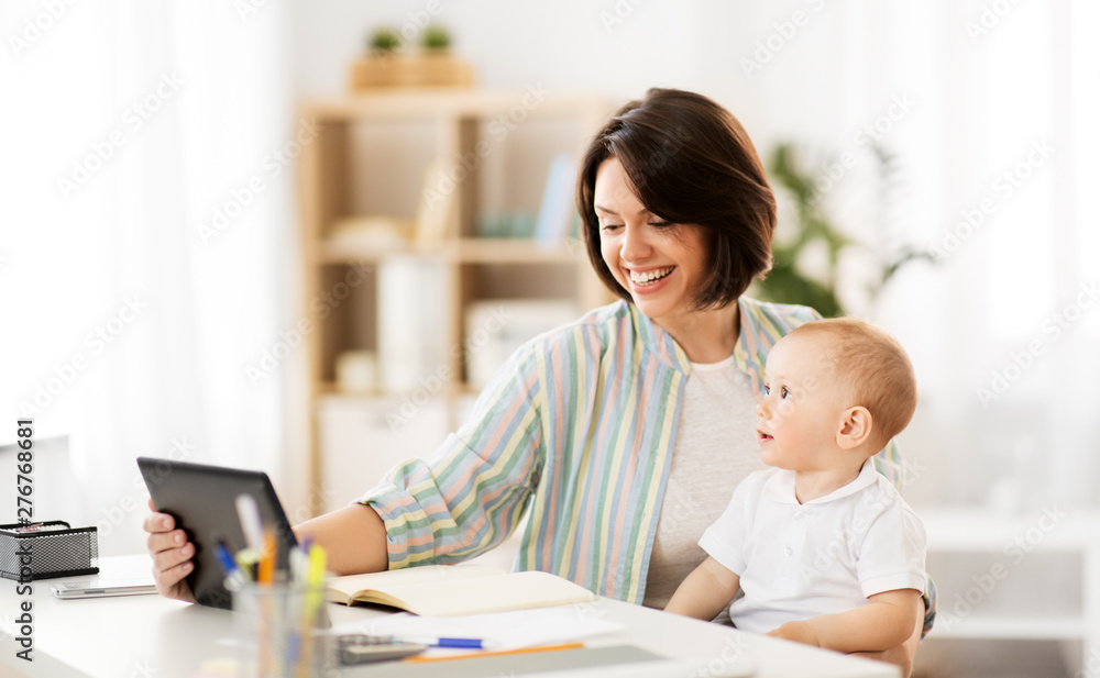 multi-tasking, freelance and motherhood concept - working mother with tablet pc computer and baby boy at home multi-tasking, freelance and motherhood concept - working mother with tablet pc computer and baby boy at home