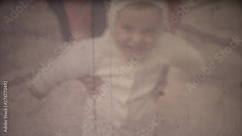 Family chronicle: Mother teach their child to walk. 8mm retro camera.