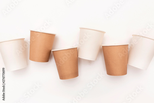Recycled paper cups on white background. Garbage sorting concept
