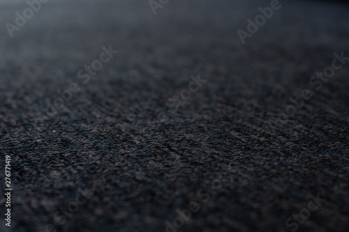 dark gray textile material perspective soft focus textured background surface