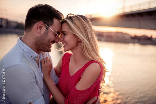 Happy young couple having fun outdoors photo