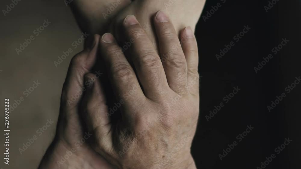 Closeup of senior couple holding hands. Slow motion Closeup of senior couple holding hands. Slow motion