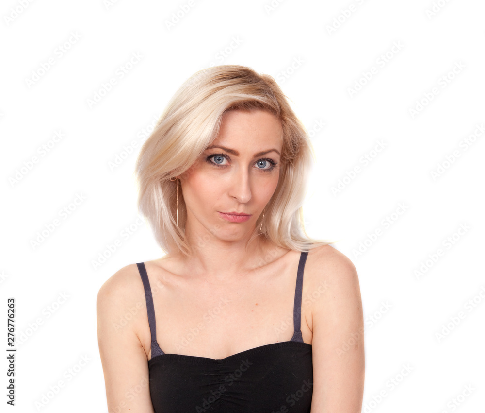 Portrait of a young bewildered blonde woman on a white background Portrait of a young bewildered blonde woman on a white background