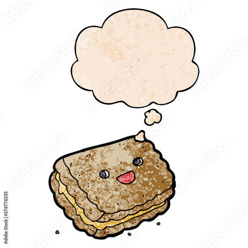 cartoon biscuit and thought bubble in grunge texture pattern style