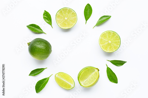 Limes with leaves isolated on white background.