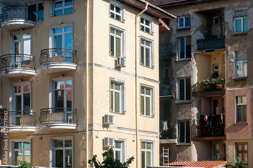 Urban renovated and neglected buildings closeup in sunny day © varbenov
