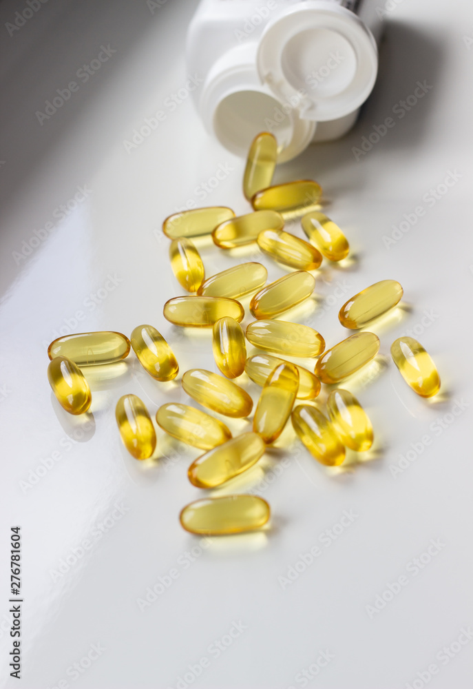 yellow vitamin pills isolated on white background omega 3 fish oil yellow vitamin pills isolated on white background omega 3 fish oil