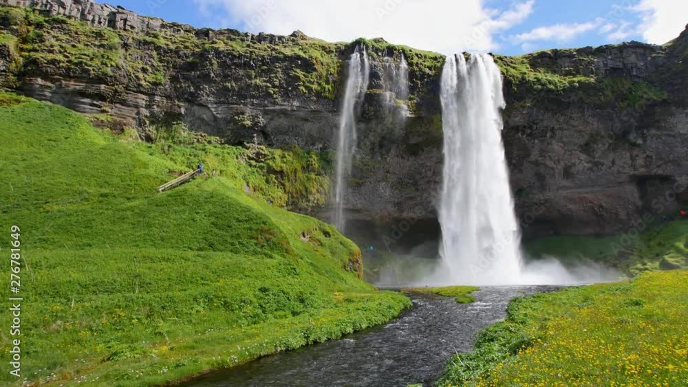 Most famous waterfall in Iceland. Majestic Seljalandsfoss in warm summer light. Most famous waterfall in Iceland. Majestic Seljalandsfoss in warm summer light.