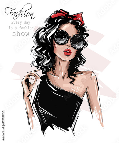 Hand drawn beautiful young woman in sunglasses. Stylish girl with bow on her head. Fashion woman look. Sketch. Vector illustration.