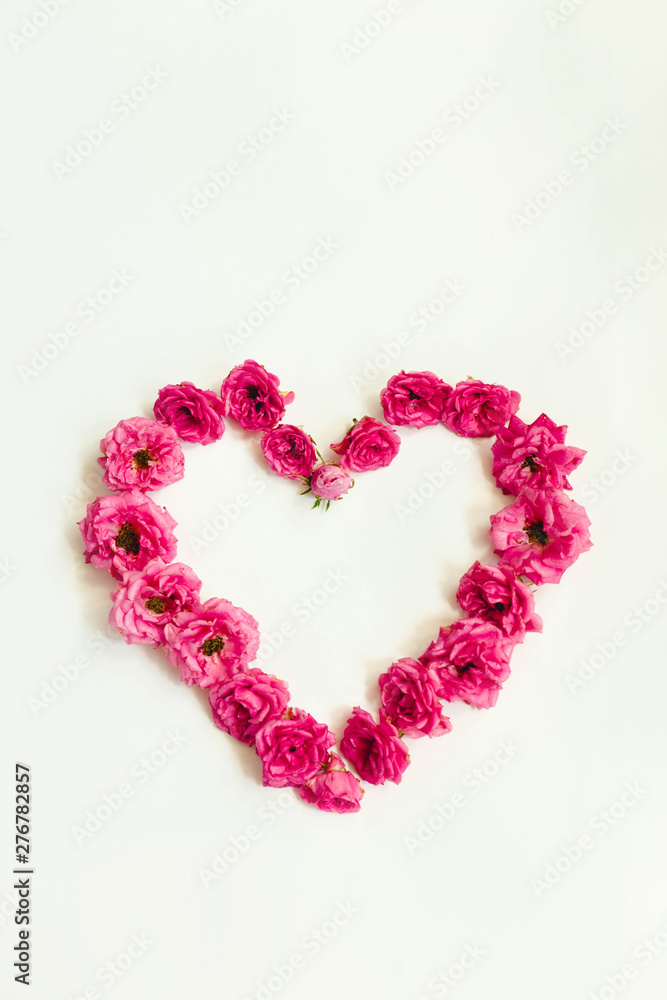 natural heart of pink roses on white background