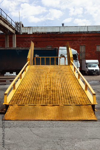 Metal ramp for cargo transfer from  car to  car and unloading on a warehouse.
