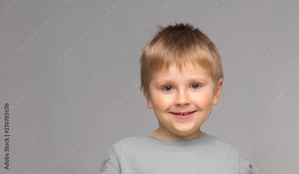 Portrait of happy smiling boy. Attractive kid in studio. Portrait of happy smiling boy. Attractive kid in studio.