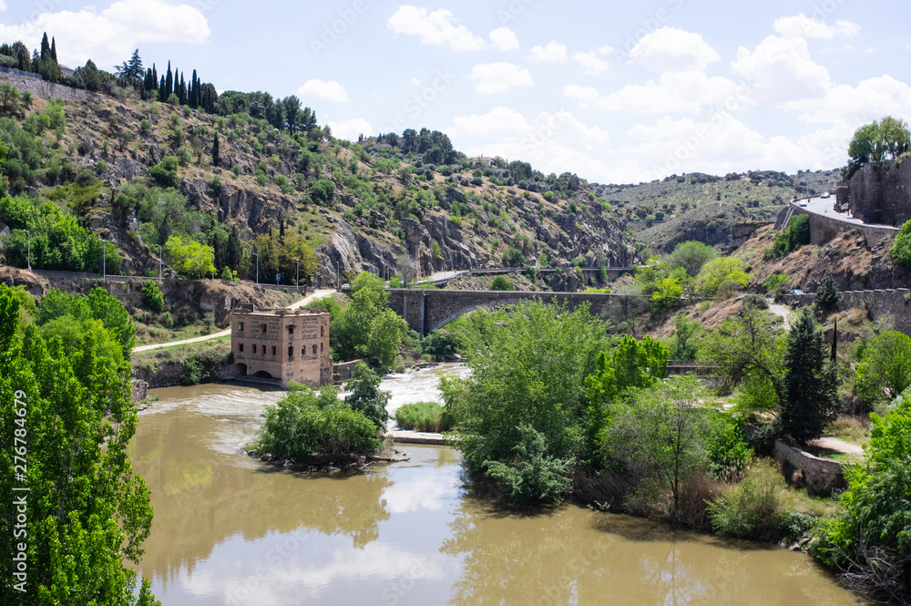 view of river from alcazar bridge, toledo, spain