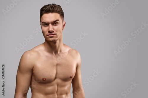 Shirtless guy raising eyebrow