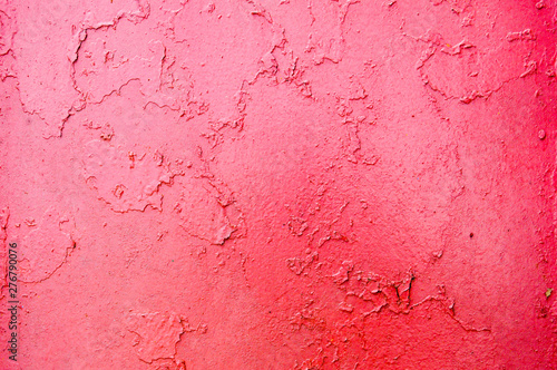 Texture of iron metal painted bright paint peeling paint old battered scratched cracked ancient rusty metal sheet wall with corrosion. The background