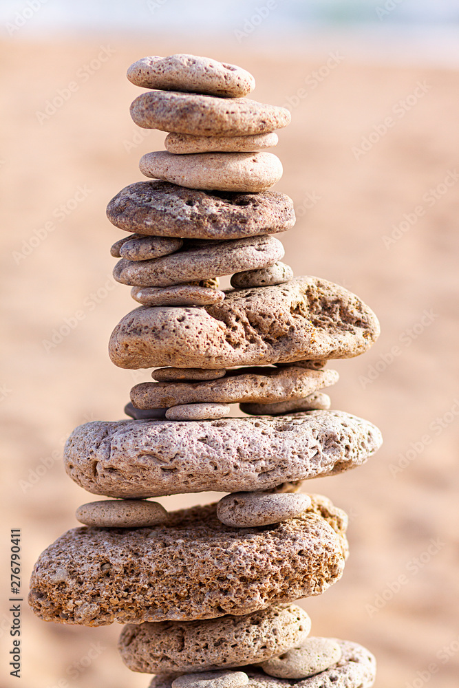 BEACH STONES STACKED WITH HORIZON OF SEA AND HEAVEN BEACH STONES STACKED WITH HORIZON OF SEA AND HEAVEN