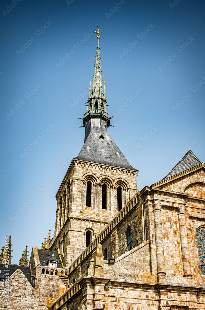 Obraz premium Mont Saint Michel, France - June 28, 2012. Tower of famous historic cathedral