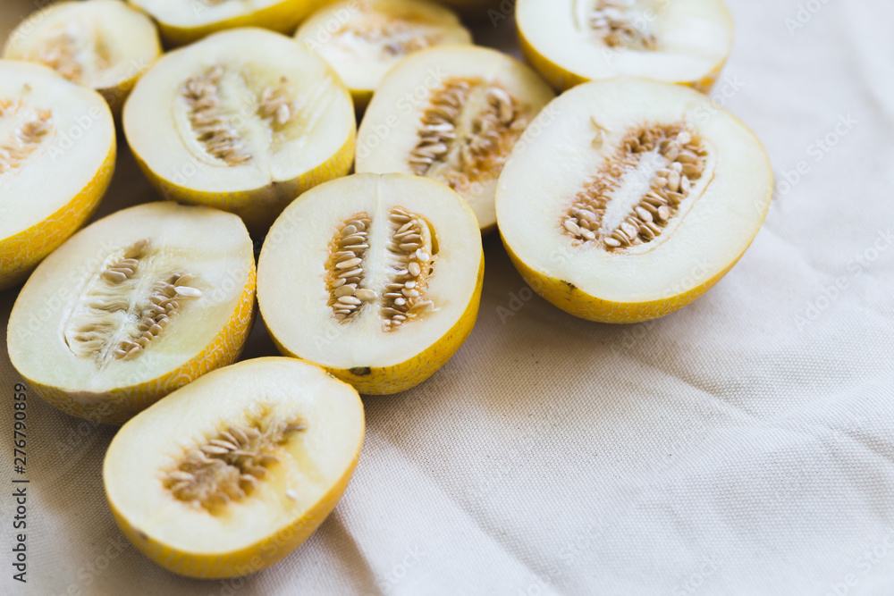 A group of brightly lit melon halves. A group of brightly lit melon halves.