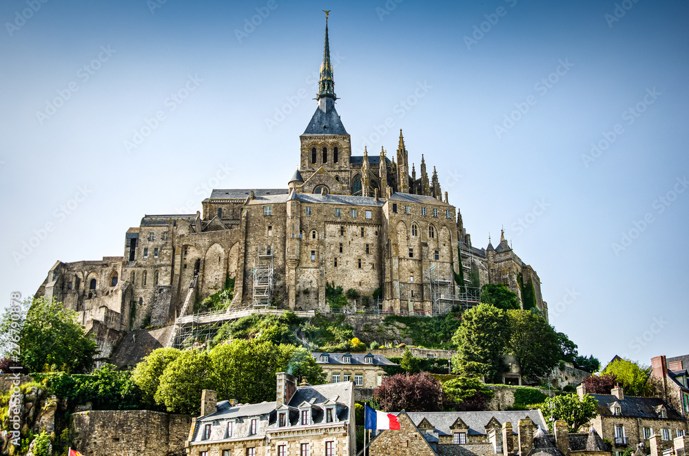 Obraz premium Mont Saint Michel, France - June 28, 2012. Famous historic cathedral at low tide 