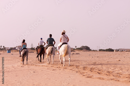 HORSE RIDING BY THE BEACH IN THE SOUTH OF SPAIN IN CADIZ