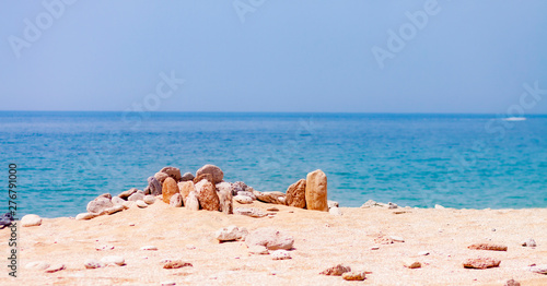 Fototapeta Naklejka Na Ścianę i Meble -  SEA LANDSCAPE WITH ROCKS ON THE SHORE OF THE BEACH