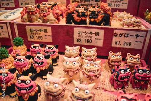 Shop with souvenir statues of Japanese mythical dog Shisa in Naha Okinawa