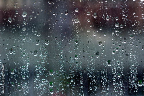 Rain droplets on the window, background. Wet glass. Autumn concept