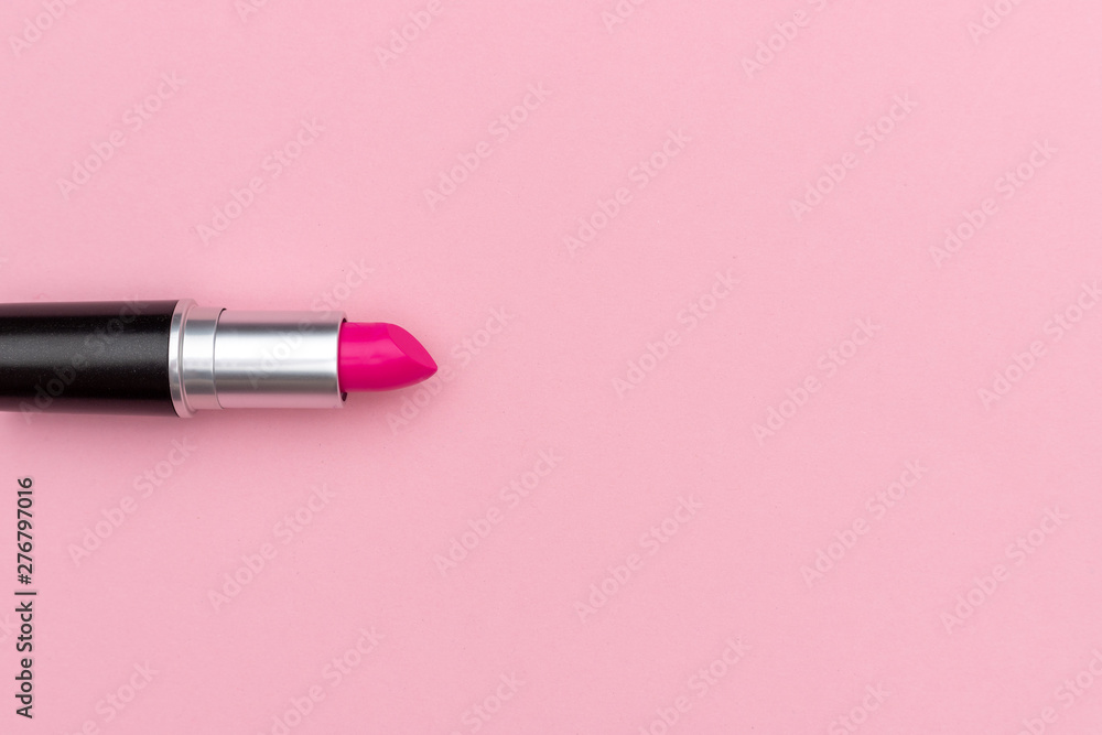 Vibrant magenta lipstick near empty space Vibrant magenta lipstick near empty space