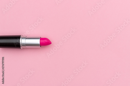 Vibrant magenta lipstick near empty space