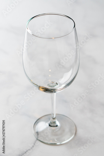 Fotografía Empty wine glass on marble table top.