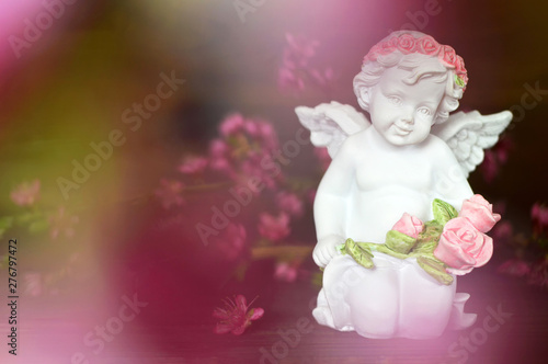 Guardian angel holding flowers © izzzy71