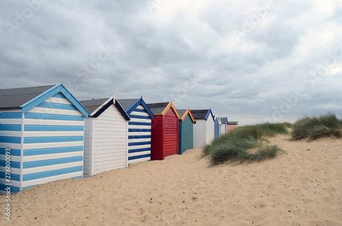 row of beach huts at southwold