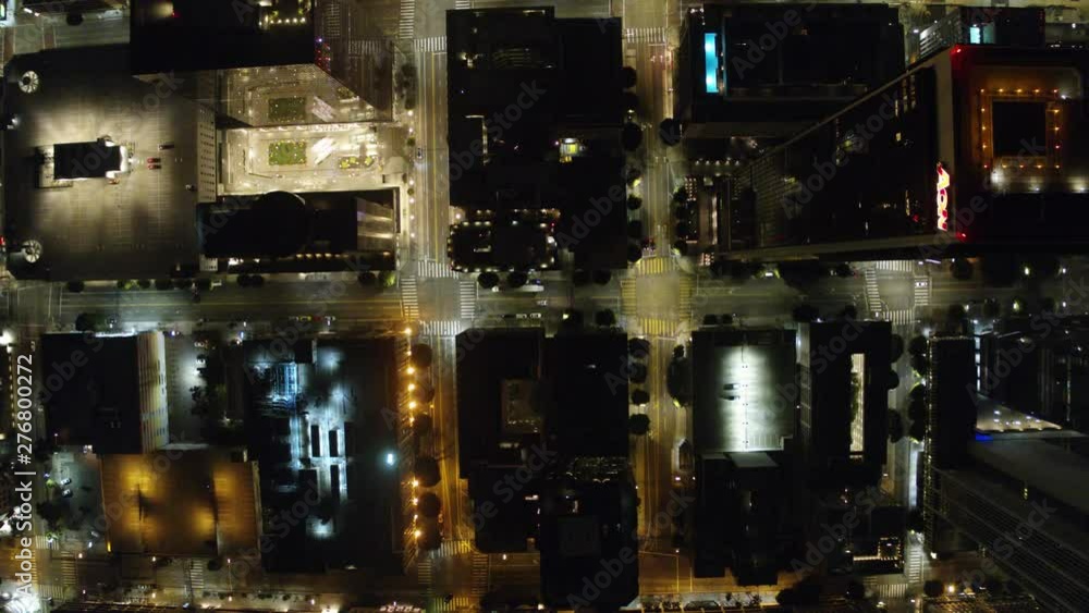 Establishing Aerial View Dow Town Looking at traffic at Night Following car Establishing Aerial View Dow Town Looking at traffic at Night Following car