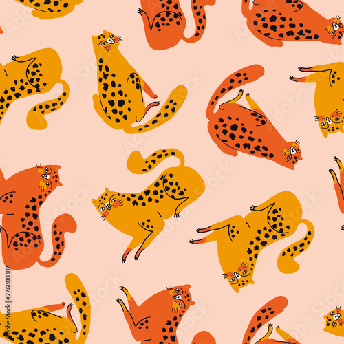 Vector seamless pattern with cute orange and red cheetahs on the pink background. Tropical animals. Fashionable fabric design for kids clothing.