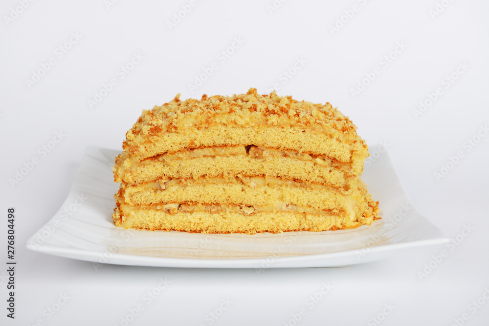 The hand-made custard honey cake with walnuts inside The hand-made custard honey cake with walnuts inside