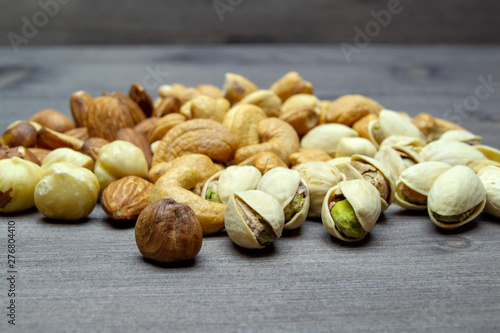 nuts almonds cashew hazelnuts scattered on a wooden table