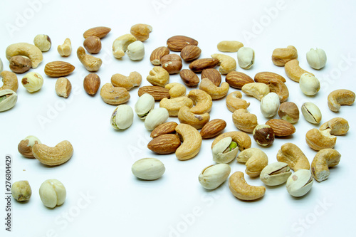 nuts almonds cashew hazelnuts scattered on white background