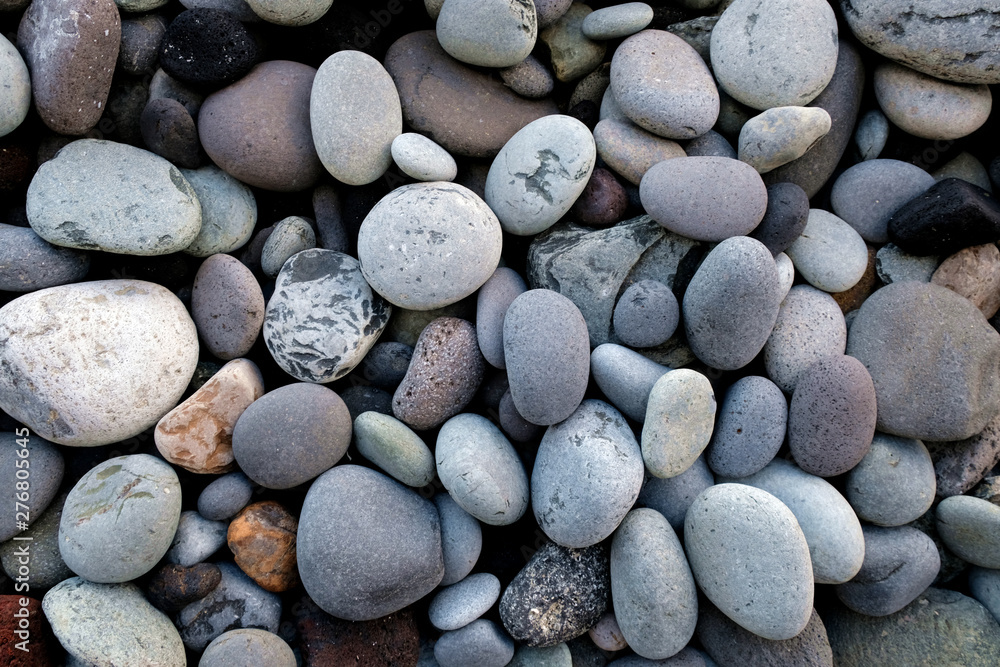 Pebbles and stones, various sizes and shapes, various minerals, close view. Pebbles and stones, various sizes and shapes, various minerals, close view.