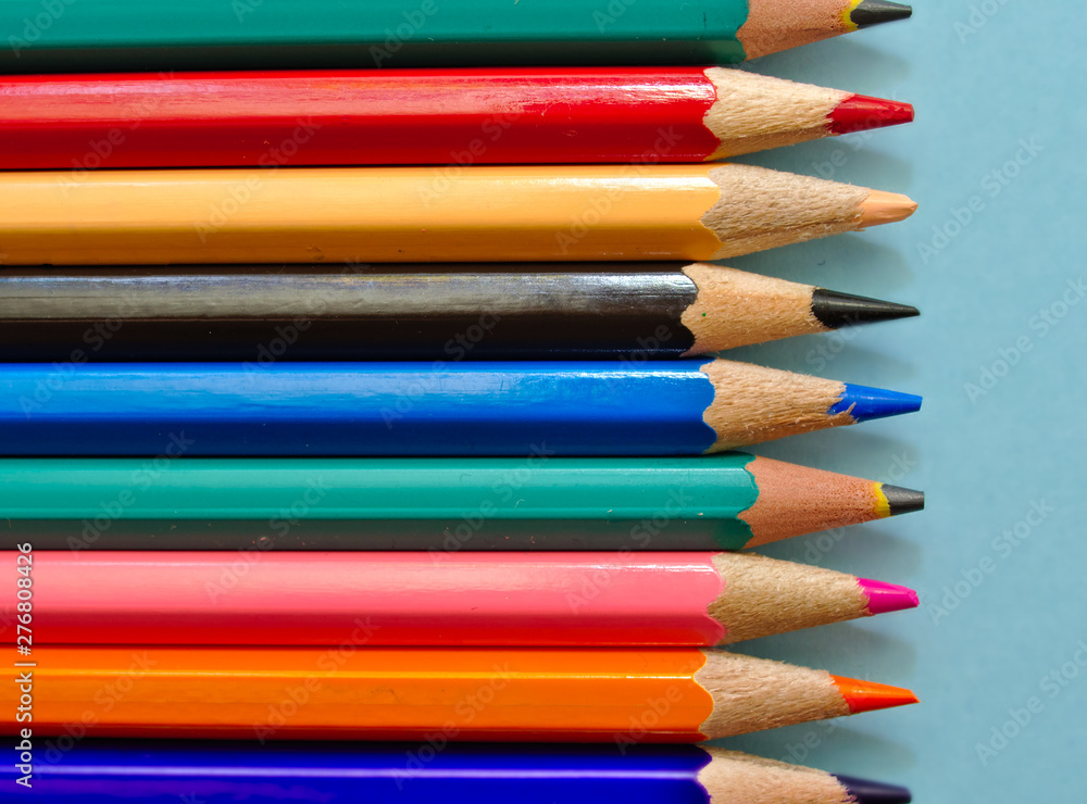 Color pencils isolated on light blue background with copy space. Color pencils isolated on light blue background with copy space.