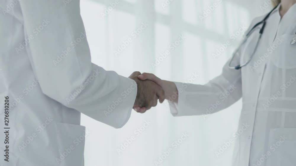Doctors is shaking hands to each other. Slow motion Doctors is shaking hands to each other. Slow motion