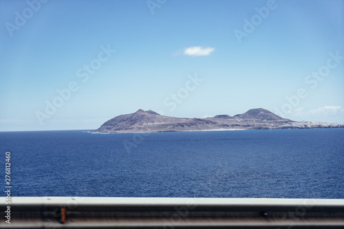 Beautiful view of the coastline of Gran Canaria, rocky shore, atlantic waves, turquise water. 