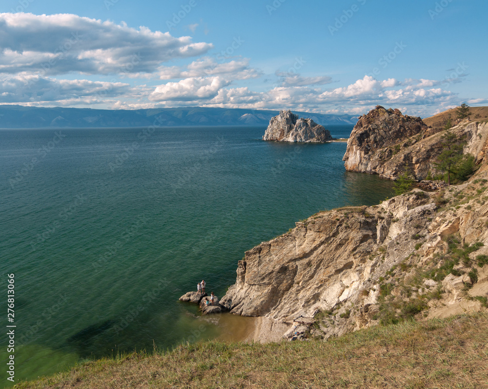 Rock Shaman Stone and cape Burhan on Olkhon Island, lake Baikal