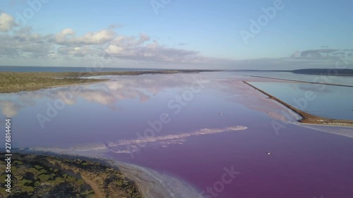 Aerial view of the Pink Lake in south west Australia. The pink lake reflects the red Australian desert sun in its clear water