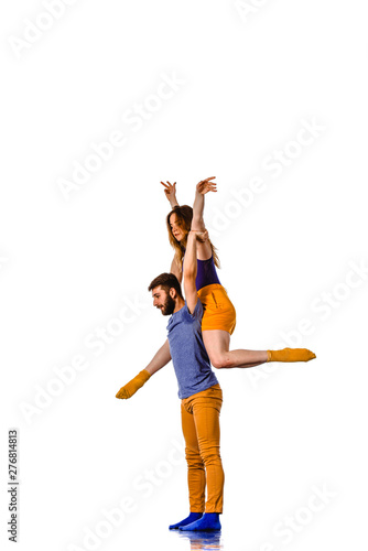 Man and woman in passionate dance pose isolated on white © qunica.com