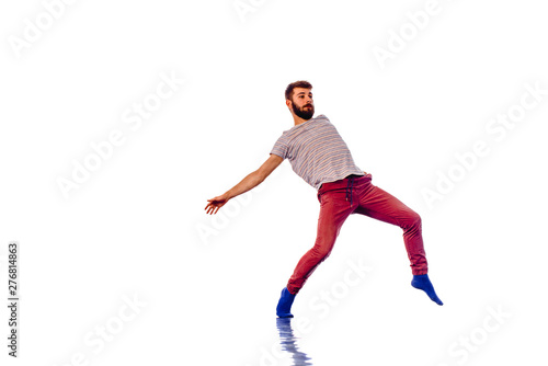 Man is dancing in the studio on a white background