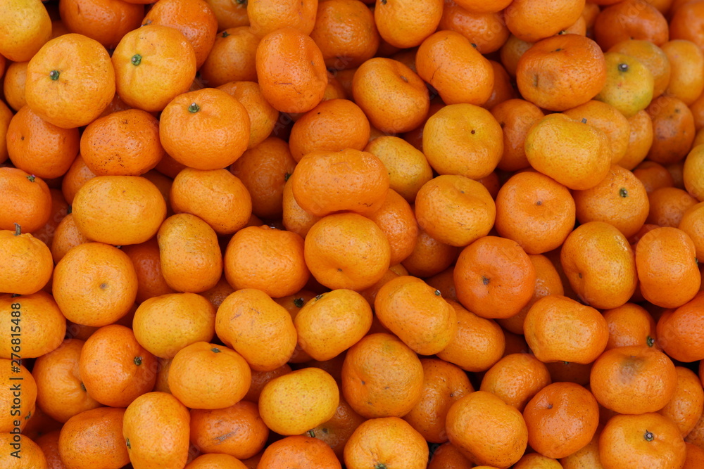 Fresh mandarin oranges texture and background.