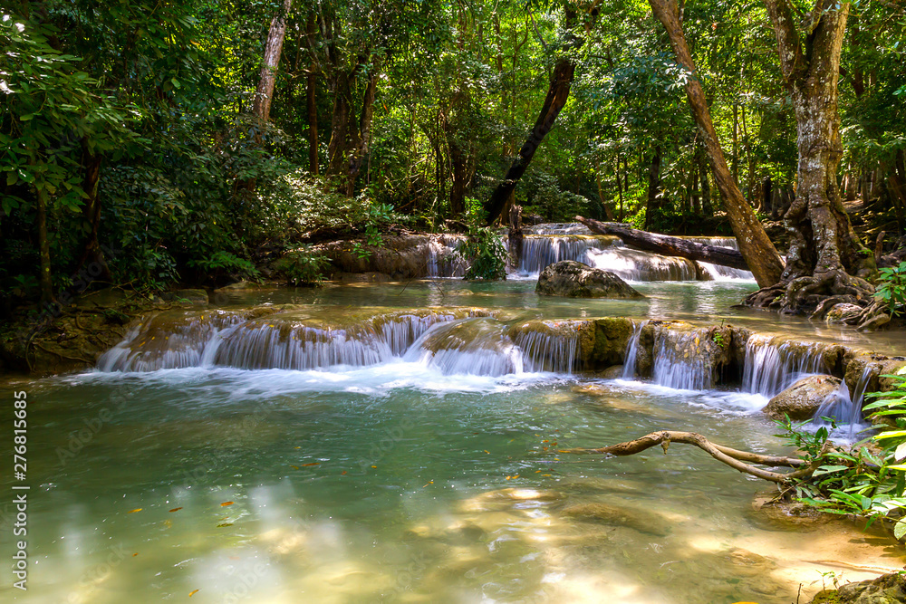 Erawan Waterfall in forest and sunlight Erawan Waterfall in forest and sunlight